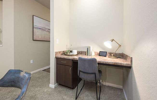 A room with a desk and chair.