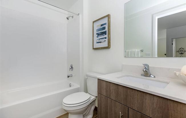 a bathroom with a sink toilet and bathtub at Jefferson Yards, Tacoma