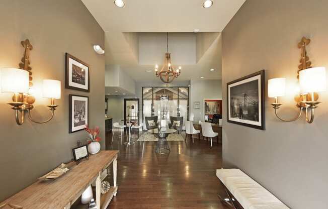 a view of a dining room with a table and chairs in the distance