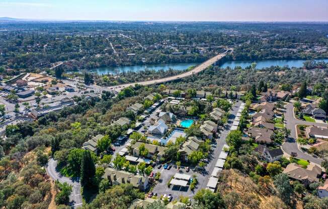 Drone View of Community showcasing the area above the complex and the river/town of Folsom in the distance. 
