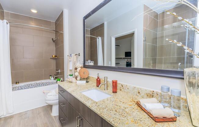 a kitchen with a sink and a mirror