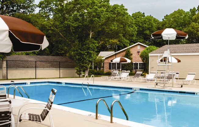 outdoor pool and sundeck with umbrellas at Lakeside Village, New York
