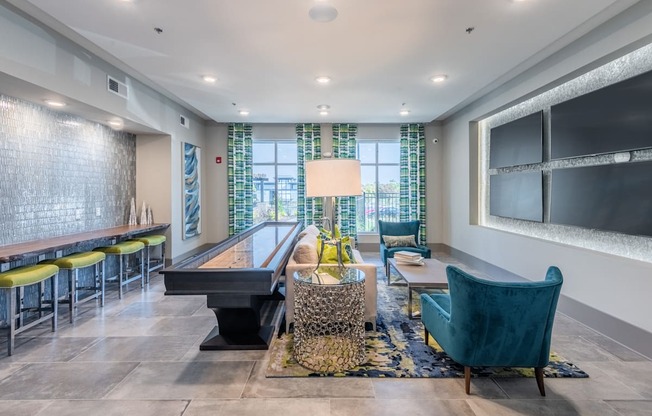 a living room with a piano and a table with chairs