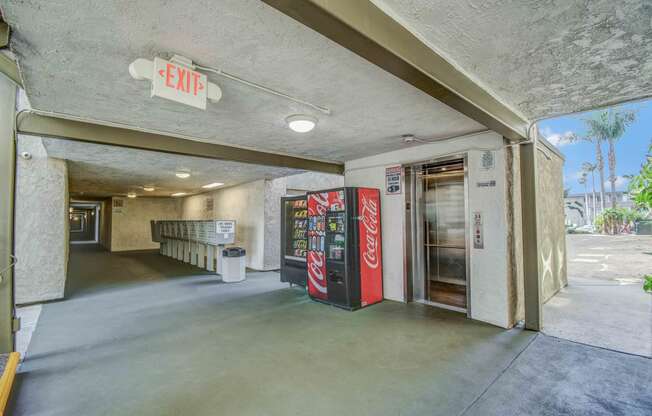 Center of the property with elevator, vending machines and Mail area