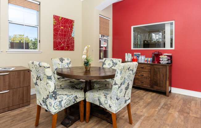 a dining room with chairs and a table