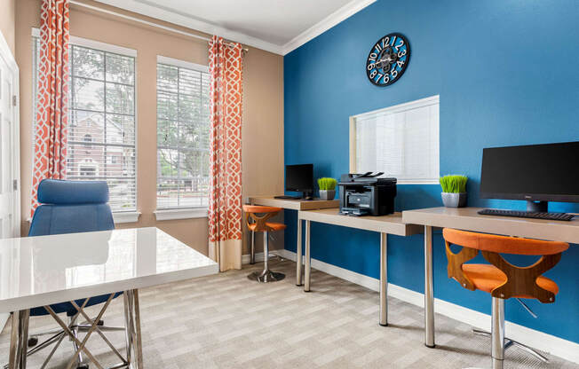 a room with a desk with a computer and a window at Villages of Cypress Creek, Houston, Texas