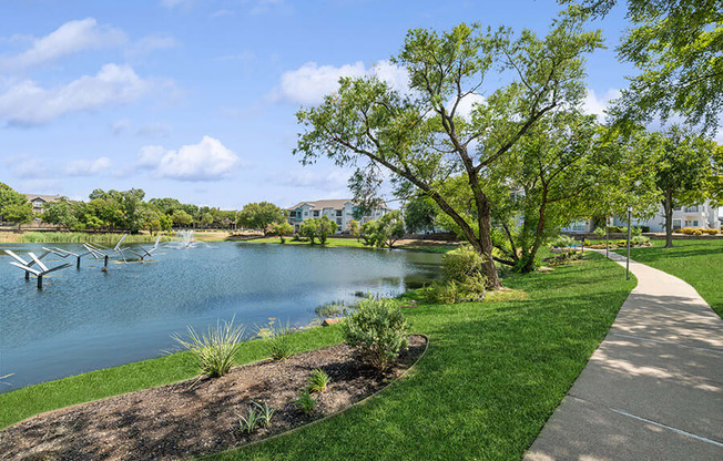 Community Pond with Fountain at Essence Apartments in Dallas, TX.