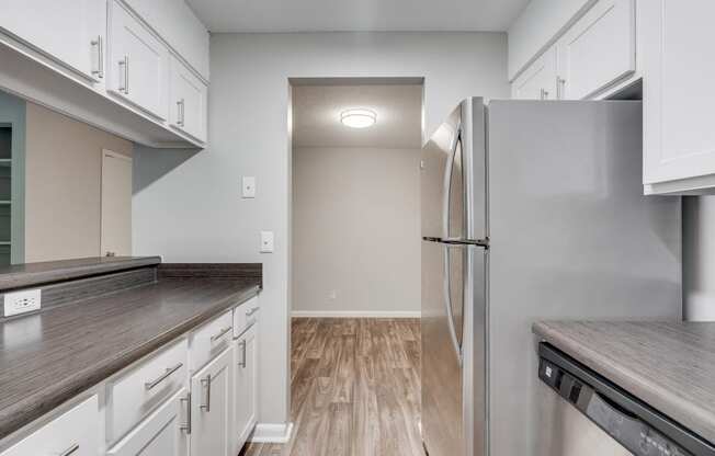 Kitchen With Stainless Steel Appliances & Wood-Style Flooring