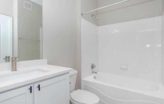 a room with a sink and a shower