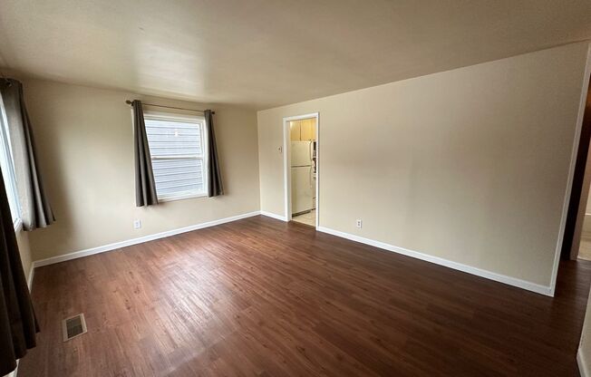 Cozy and Conveniently Located 2 Bed 1 Bath Spokane Home w/ Detached Garage & Heated Multipurpose Room!