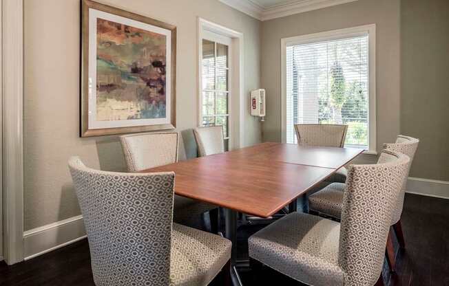 Private meeting room with a large table, comfortable chairs, and soft neutral décor.