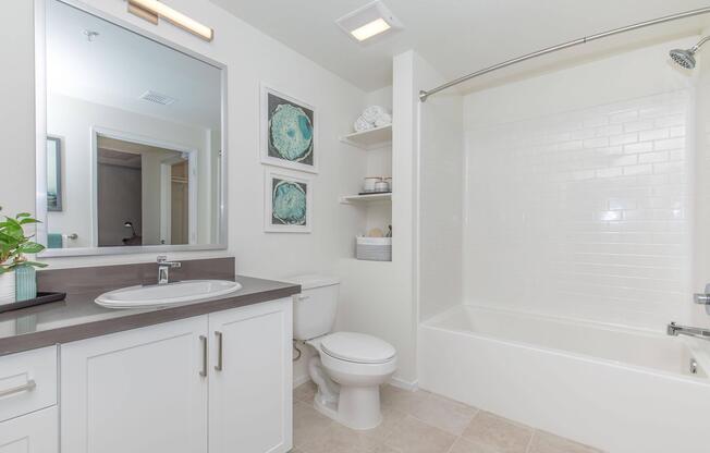 a room with a sink and a mirror