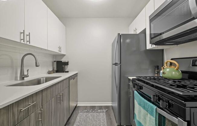 a kitchen with stainless steel appliances and a sink