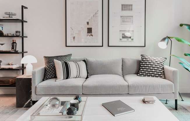 a living room with a couch and a coffee table at The Lively, Jersey City, NJ