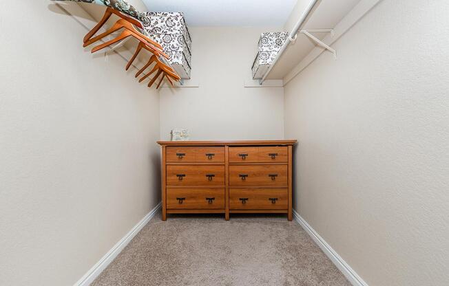 a bedroom with a wooden floor