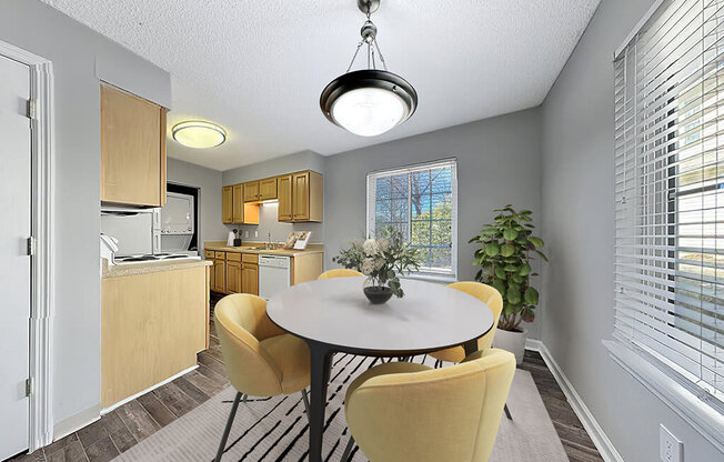 a dining room with a table and chairs