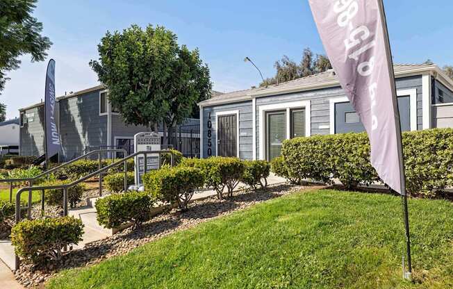 A row of houses with a sign that says