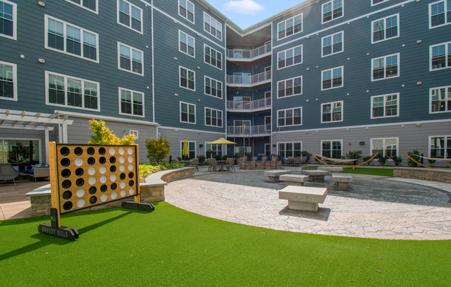 Courtyard games | The Q | Quincy, MA  Apartments