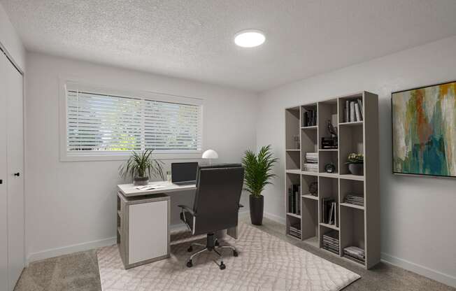 an office with a desk and a computer