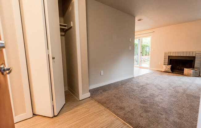 A room with a fireplace and a rug on the floor. at Notch 8, Washington, 98444