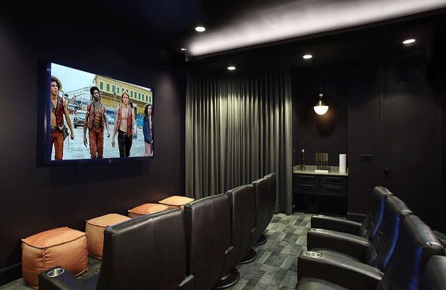 Movie theater room with lounge chairs