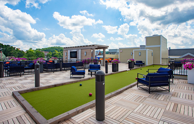 Bocce ball on the rooftop surrounded by comfortable outdoor seating options