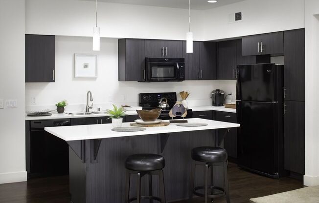 Updated Kitchen With Black Appliances at Palomar Station, San Marcos