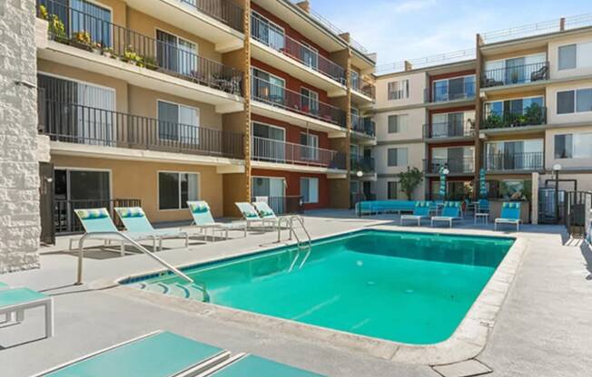 a swimming pool in the middle of an apartment building