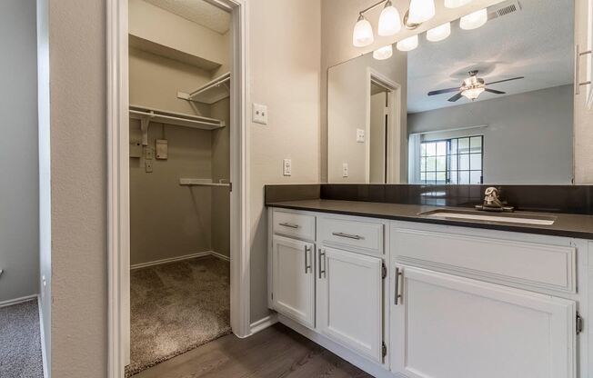 Bathroom with black countertops