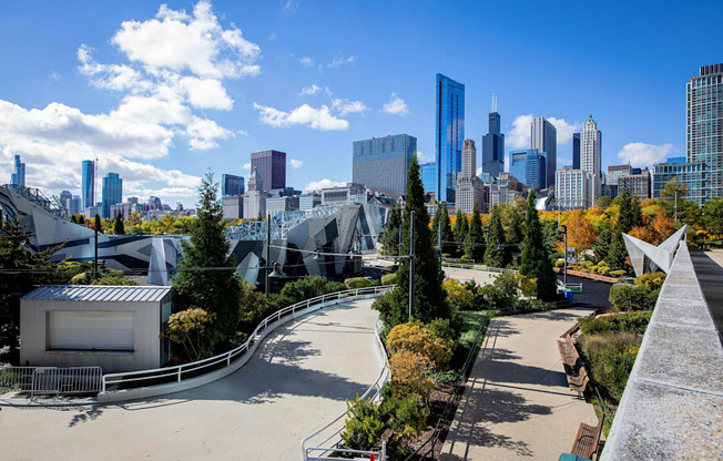 a view of a park with a city in the background
