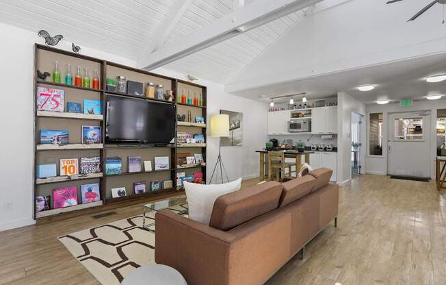 A living room with a couch and a television.