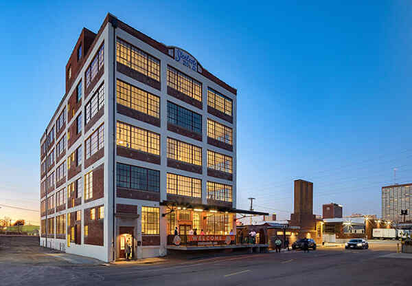 Steelcote Lofts exterior, historic building at dusk at Steelcote Square, St. Louis, Missouri