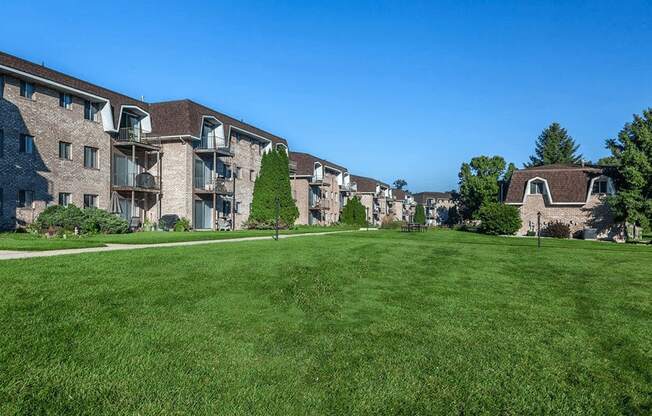 exterior of lamberton lake apartments with lots of green area