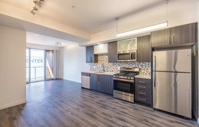 a view of a kitchen with a geometric design on the wall