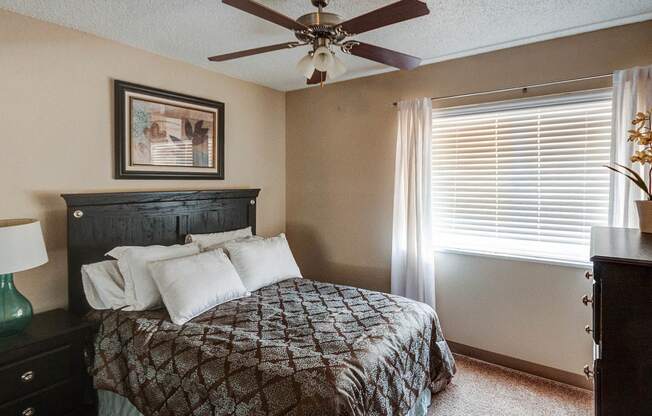 Bedroom with Ceiling Fan at University Village Apartments, Colorado Springs, Colorado