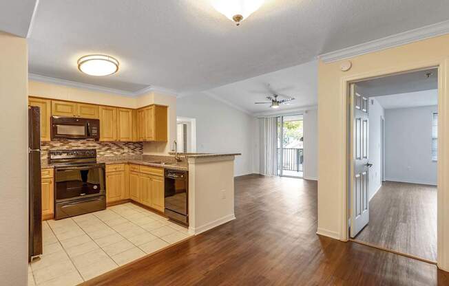 A kitchen with wooden cabinets and a white ceiling.