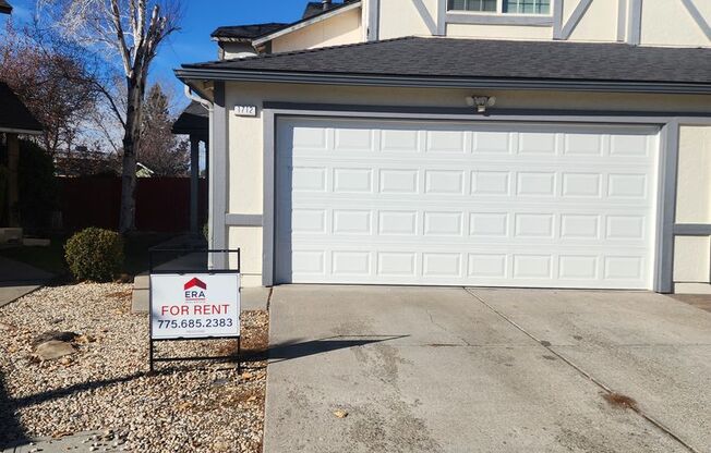 Beautifully updated, 3 bedroom, 2 1/2 bath town home with a 2-car garage and a fenced back yard.