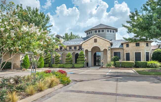 A large house with a grey roof and a grey garage door.