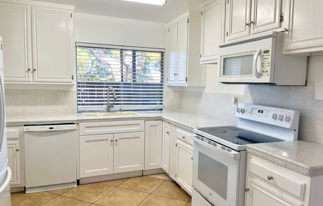 Spacious 3 Bedroom 2 Bathroom Town-Home with In-Unit Laundry, Pool and 2 Parking Spaces!
