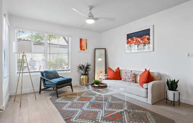 a living room with a couch and a chair