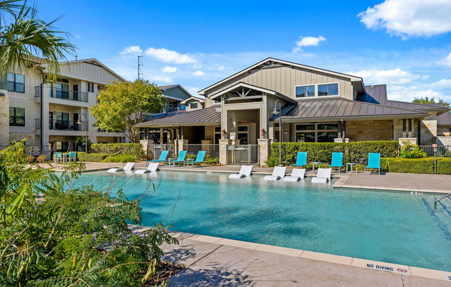 Pool With Relaxing Chairs at Bridge at Southpark Meadows, Texas