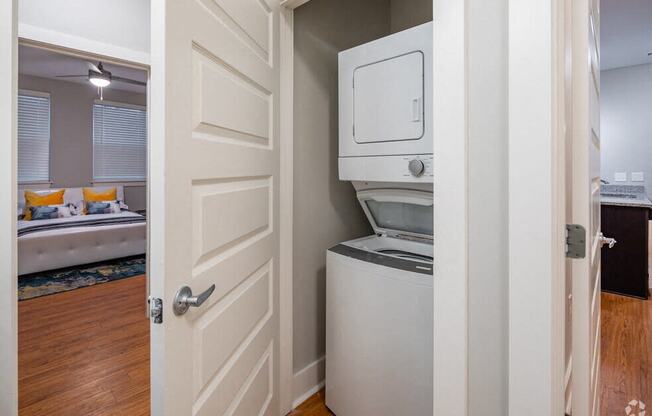 a laundry room with a washer and dryer in a closet