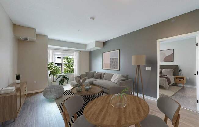 A modern living room with a wooden table and grey chairs.