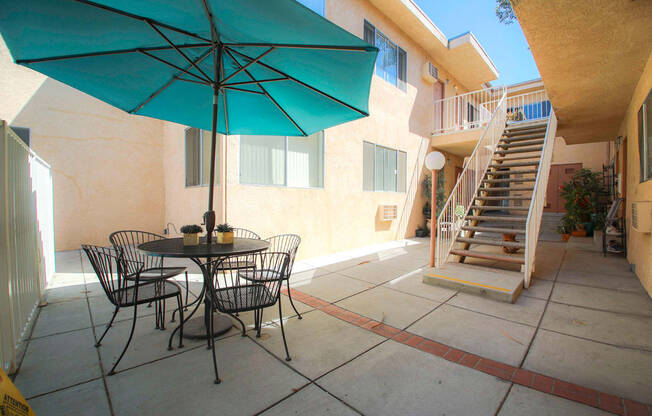 Courtyard picnic space adjacent to solar heated pool.