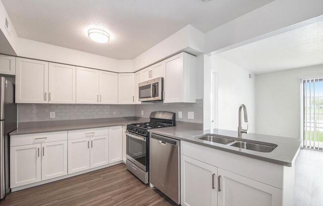Renovated Kitchen with Shaker Cabinetry at The Crossings Apartments, Grand Rapids, Michigan