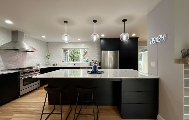 Stunning Single-Level SW Portland 3-Bedroom Home with Designer Kitchen, Park-Like Backyard, EV Charger & Landscaping Included