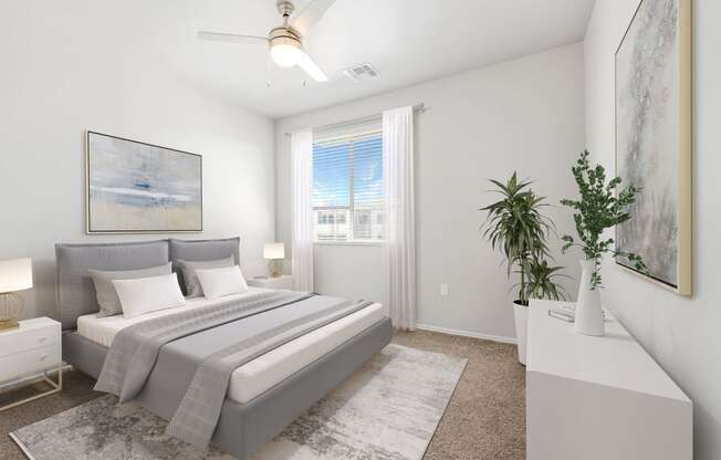 a bedroom with a large bed and a ceiling fan