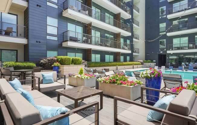 modern design poolside seating area at Knox Heights in Dallas, TX