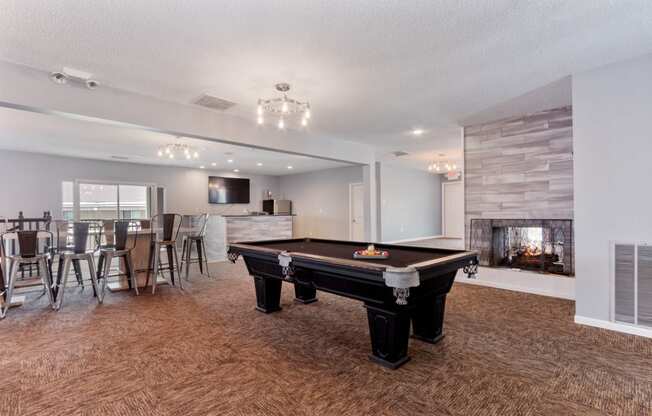 the preserve at ballantyne commons clubhouse with pool table and fireplace at Eastwood Crossings, Kansas City