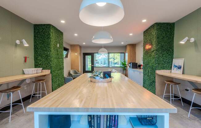 A conference room with a long table and chairs.